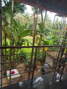 a view of a garden from a balcony at Lakshika tent stay in Gokarna