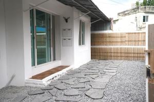 a walkway leading to a door of a house at WhiteTreeHouse 