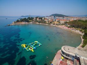 an aerial view of a beach with a water slide at Apartments Sand Beach in Split