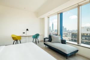 Postel nebo postele na pokoji v ubytování amba Taipei Songshan