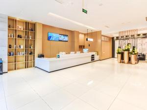 a large lobby with a white counter in a store at City Comfort Inn Chongqing Pengshui Yujing Jiangshan in Pengshui