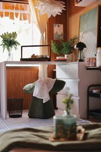 a toy hat in a room with plants on the floor at Xing Retreat & Spa Măng Đen in Kon Plong