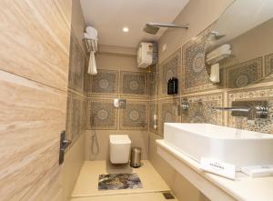 a bathroom with a sink and a toilet at PENANG Home Away From Home in Darjeeling +15 photos