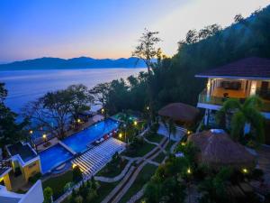 una vista aerea di un resort con piscina di Anilao Awari Bay Resort a Città di Batangas