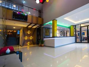 a lobby of a building with a bar in it at UDTel Boutique Hotel Udonthani in Udon Thani +177 photos
