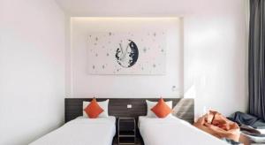 Ένα ή περισσότερα κρεβάτια σε δωμάτιο στο PIMDARA HOTEL