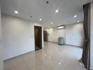 an empty room with a door and a tile floor at Noi Bai Airport in Hanoi