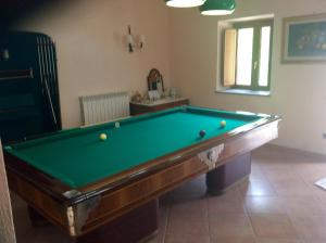 a room with a pool table with balls on it at Masseria degli Alberti in Mormanno