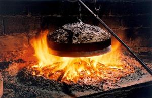 a cake sitting on top of a fire at The Village in Igoumenitsa +22 photos