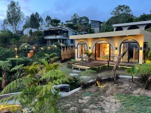 a house with a garden in front of it at Stone Ridge Kintamani in Kintamani +29 photos