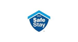 a blue sales sign with the words sale stay at Travelodge by Wyndham Bay Shore Long Island in Bay Shore