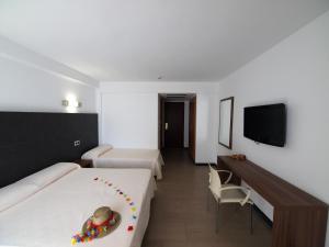 Postel nebo postele na pokoji v ubytování Hotel Astoria Park