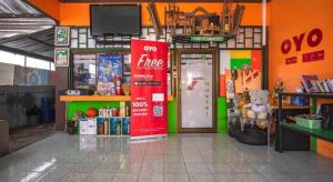 a store with a coca cola sign in a room at OYO 586 I Hostel Phuket in Patong Beach