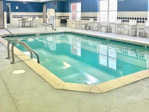 a large swimming pool with blue water at Comfort Inn & Suites Calhoun South in Calhoun