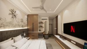 a bedroom with a tv and a bed in a room at The White Castle Hotel in Mysore