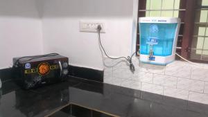 a water heater and a box on a counter at 3 bedroom country home with a lush full backyard in Trichūr +24 photos
