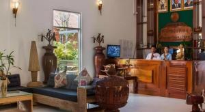 a store with two people in a room with a counter at Sambopich Chenla Hotel in Kompong Thom +203 photos