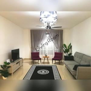 a living room with a couch and a tv at Homestay Putrajaya Near Lake, Dataran Putrajaya - Boulevard Putrajaya, Shaftsbury Alamanda & Masjid Putra in Putrajaya