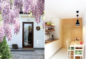 a kitchen and dining area of a house with purple flowers at Garden House in Timişoara