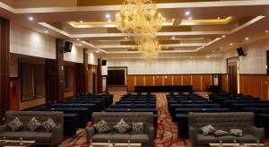 a large room with chairs and a chandelier at Hotel Grand Permata Hati in Banda Aceh +118 photos