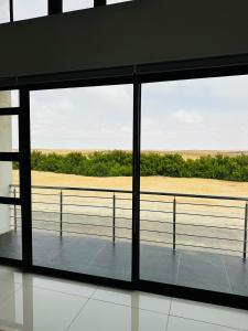 a view of the beach from a window in a building at Duinen Suites in Walvis Bay