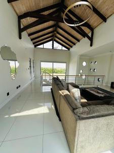 a living room with a couch and a table at Duinen Suites in Walvis Bay