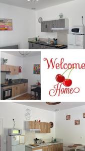 a kitchen with a counter with a welcome home sign at LES CERISIERS Mb4 - Mb5 - Mb6 "parking privé" in Damparis