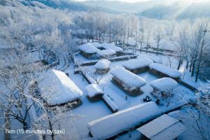 a group of houses covered in snow at InstaHotel-MainBranch in Suwon +168 photos