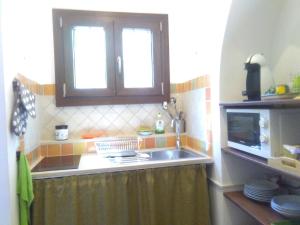 Kuchyňa alebo kuchynka v ubytovaní Casa Normanna + 17 fotografií