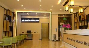 a lobby with chairs and a desk in a building at GreenTree Alliance Hotel Kunming Chuanjin Road Branch in Kunming