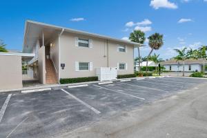 a parking lot in front of a building at Olde Naples Paradise 803 in Naples