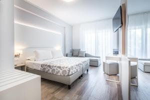 Cama ou camas em um quarto em Hotel Bologna