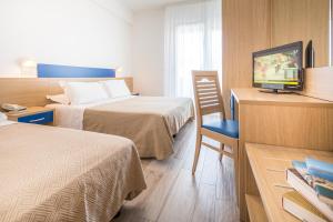 Cama ou camas em um quarto em Hotel Bologna