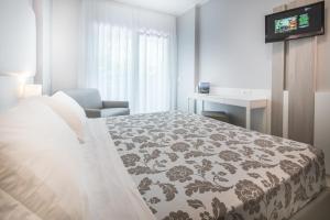 Cama ou camas em um quarto em Hotel Bologna