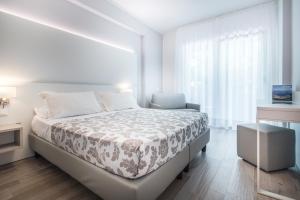 Cama ou camas em um quarto em Hotel Bologna