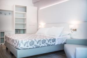 Cama ou camas em um quarto em Hotel Bologna