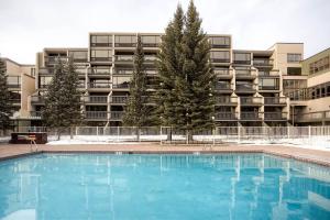 a large swimming pool in front of a building at The Keystone Lodge and Spa by Keystone Resort in Keystone