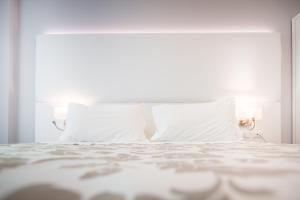 Cama ou camas em um quarto em Hotel Bologna
