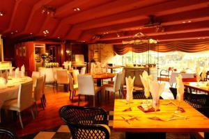 a dining room with tables and chairs at Gunma Royal Hotel in Maebashi