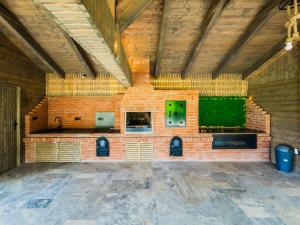 a large room with a brick wall in a building at Aza Chalet in Predeluţ