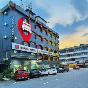 a hotel with a large red heart on the side of it at Kimal Hotel Taiping in Taiping