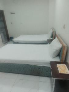 Ένα ή περισσότερα κρεβάτια σε δωμάτιο στο Mall City hotel