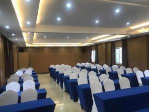 a large room with blue and white chairs in it at James Joyce Coffetel· Hefei Anhui Agricultural University in Hefei