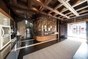 a large kitchen with a bar in a building at Yongin Valentine in Yongin