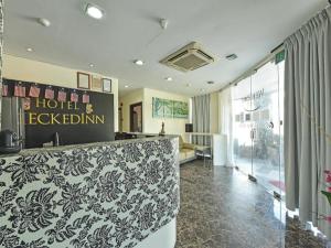 a hotel reception desk in a hotel room at Hotel CheckedInn in Ipoh