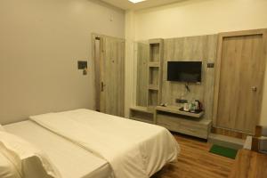 Ένα ή περισσότερα κρεβάτια σε δωμάτιο στο Hotel Paris Garden +5 φωτογραφίες