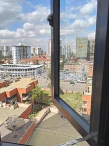 a view from a window of a city with a parking lot at Elegant homes , KENYA in Nairobi