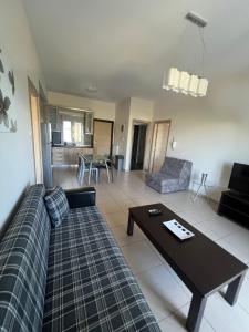 a living room with a couch and a table at Bivas Apartments in Limenas