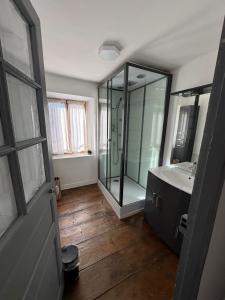 a bathroom with a glass shower and a sink at L'etoile Filante in Formiguères +17 photos