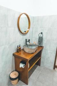 a bathroom with a sink and a mirror at Villa Dot -Beach Front and private pool villa in Gili Air +18 photos